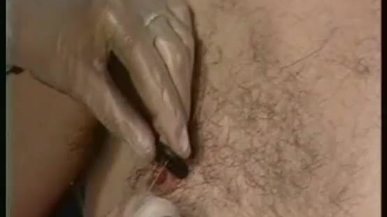 Dominatrix puts alot of needles to slave his balls and nipples other slave got spanked on her ass